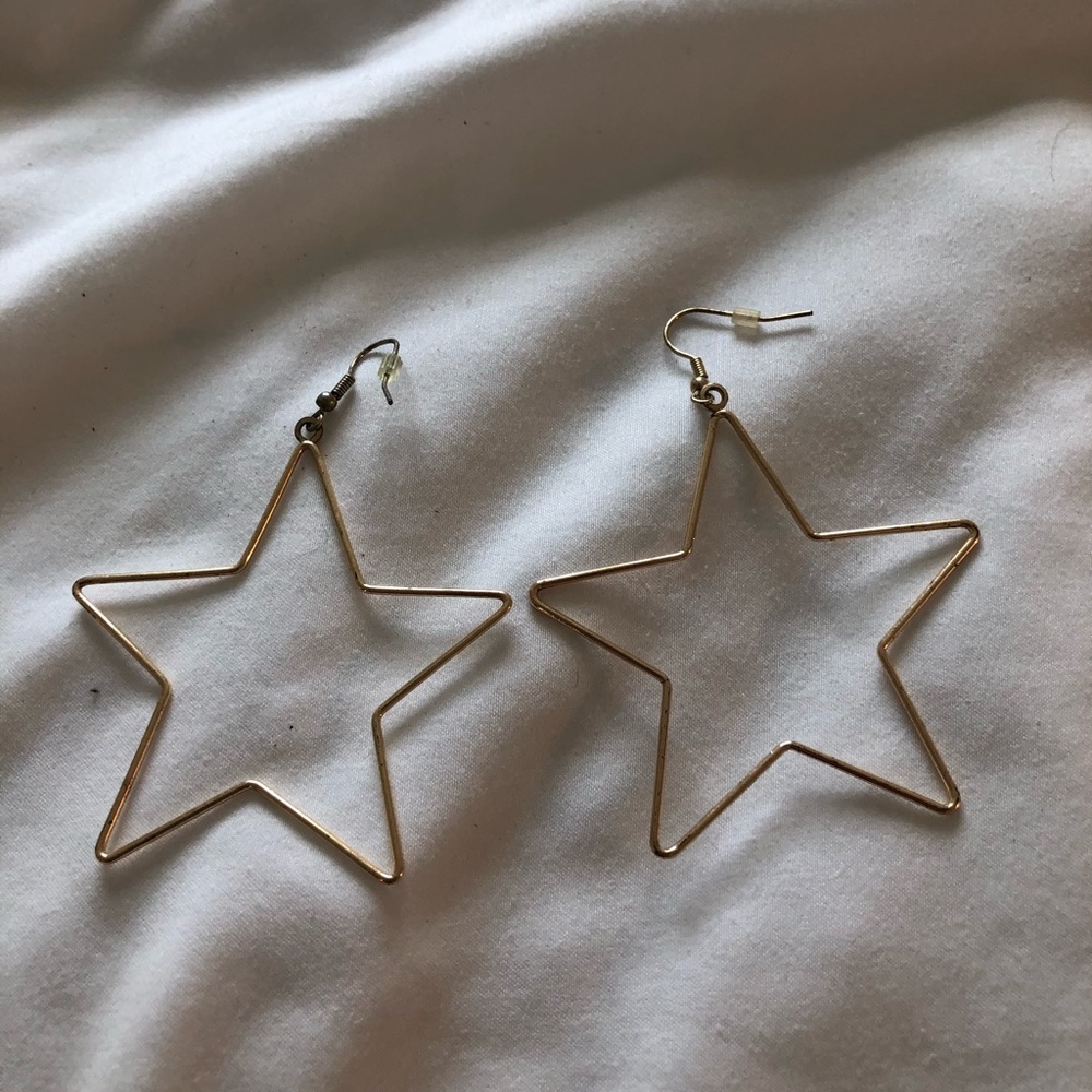 Gold star dangle earrings